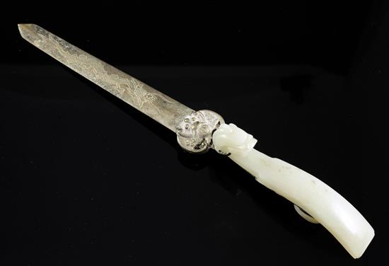 A Chinese pale celadon jade belt hook, mounted as a paperknife, 19th century, handle 9.4cm